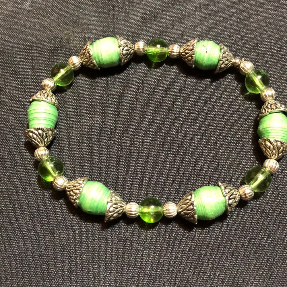 Green and silver colored bracelet